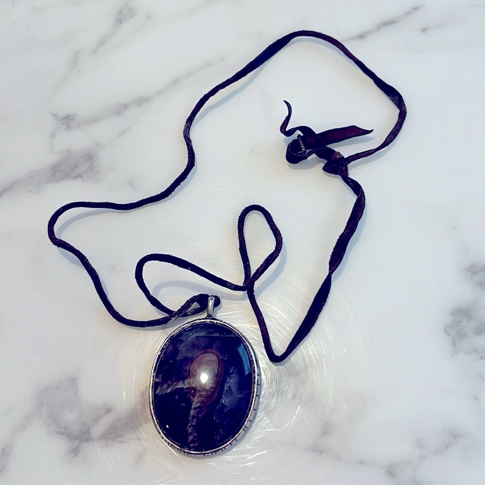 Amethyst stone cabochon on leather